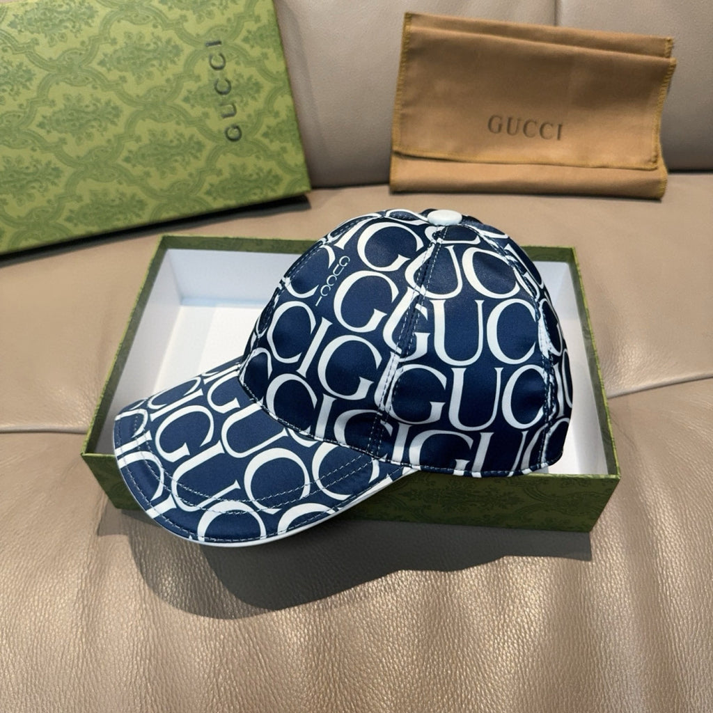Gucci baseball cap in navy with white GG monogram print, front panel and curved brim.