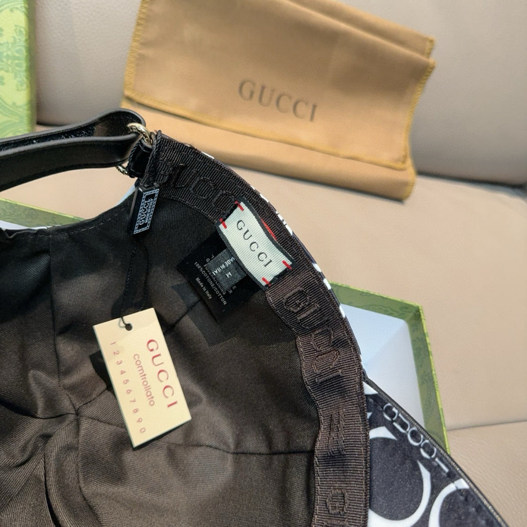 Gucci cap inner label and adjustable strap detail on GG-pattern crown