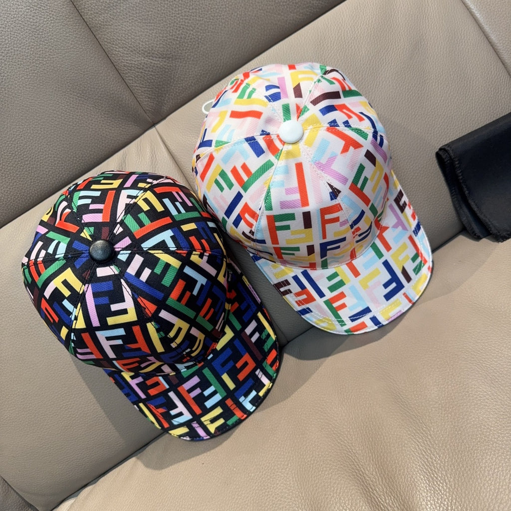 Pair of Fendi logo-print baseball caps in multicolor patterns