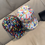 Pair of Fendi logo-print baseball caps in multicolor patterns