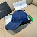 Blue satin baseball cap with front panel stitching and curved brim.