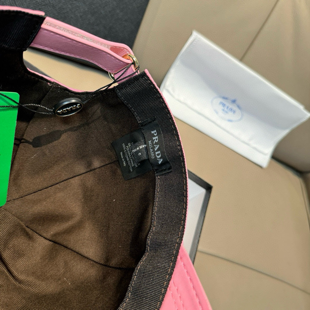 Pink cap with inside label, hang tags, and logo trim detail