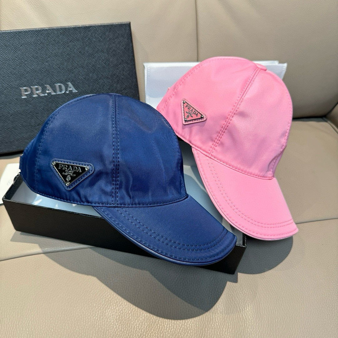 Prada baseball caps set: pink and blue with triangular logo patches