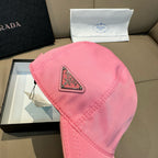 Pink baseball cap with Prada triangular logo patch on front crown