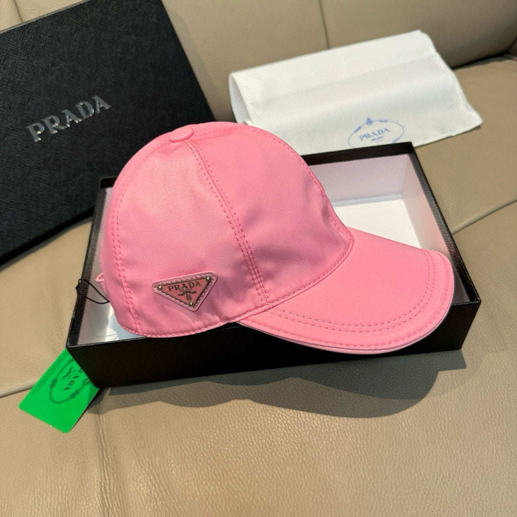 Pink baseball cap with stitched panel seams and Prada triangular logo patch