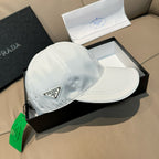 Prada cap in white satin with curved brim and metal logo plaque
