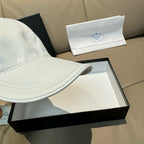 Prada cap in white satin with curved brim and side seam stitching