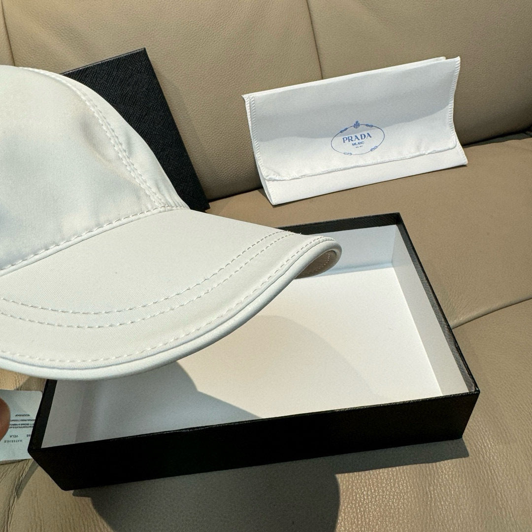 Prada cap in white satin with curved brim and side seam stitching