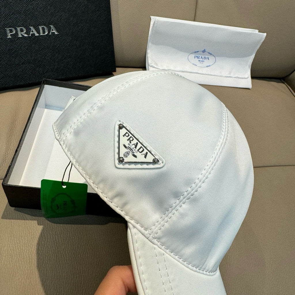 Prada cap in white satin with Prada logo badge on front panel