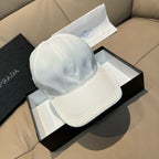 Prada cap in white satin with curved brim and stitched crown seams