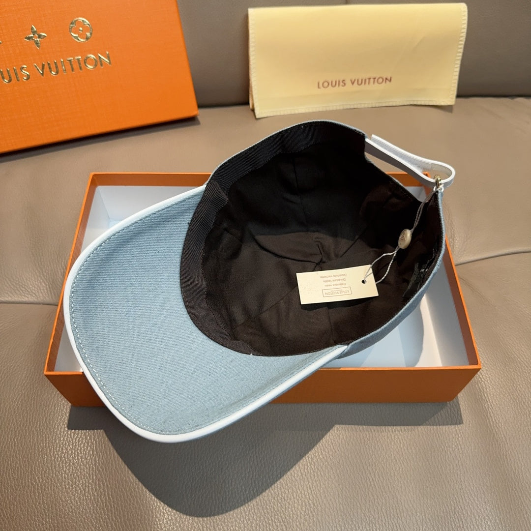 Louis Vuitton denim cap in light blue, interior shown with black lining inside.