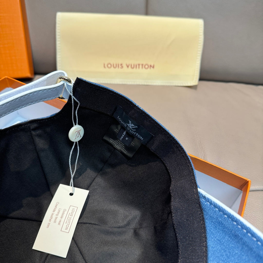 Louis Vuitton denim cap with black inner strap and hanging product tag
