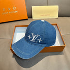 Louis Vuitton blue denim baseball cap with LV logo on front panel