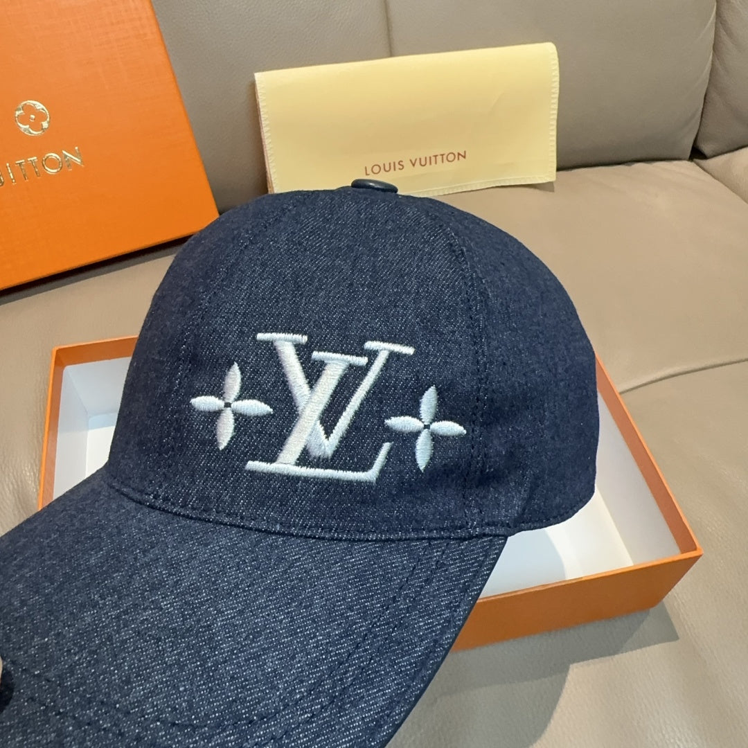 Louis Vuitton denim cap close-up, dark blue with LV monogram flower embroidery on front