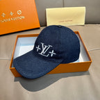 Louis Vuitton denim cap with dark blue crown and LV monogram flower logo, front view