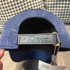 Dior cap with black lining and Dior-printed leather strap on adjustable back.