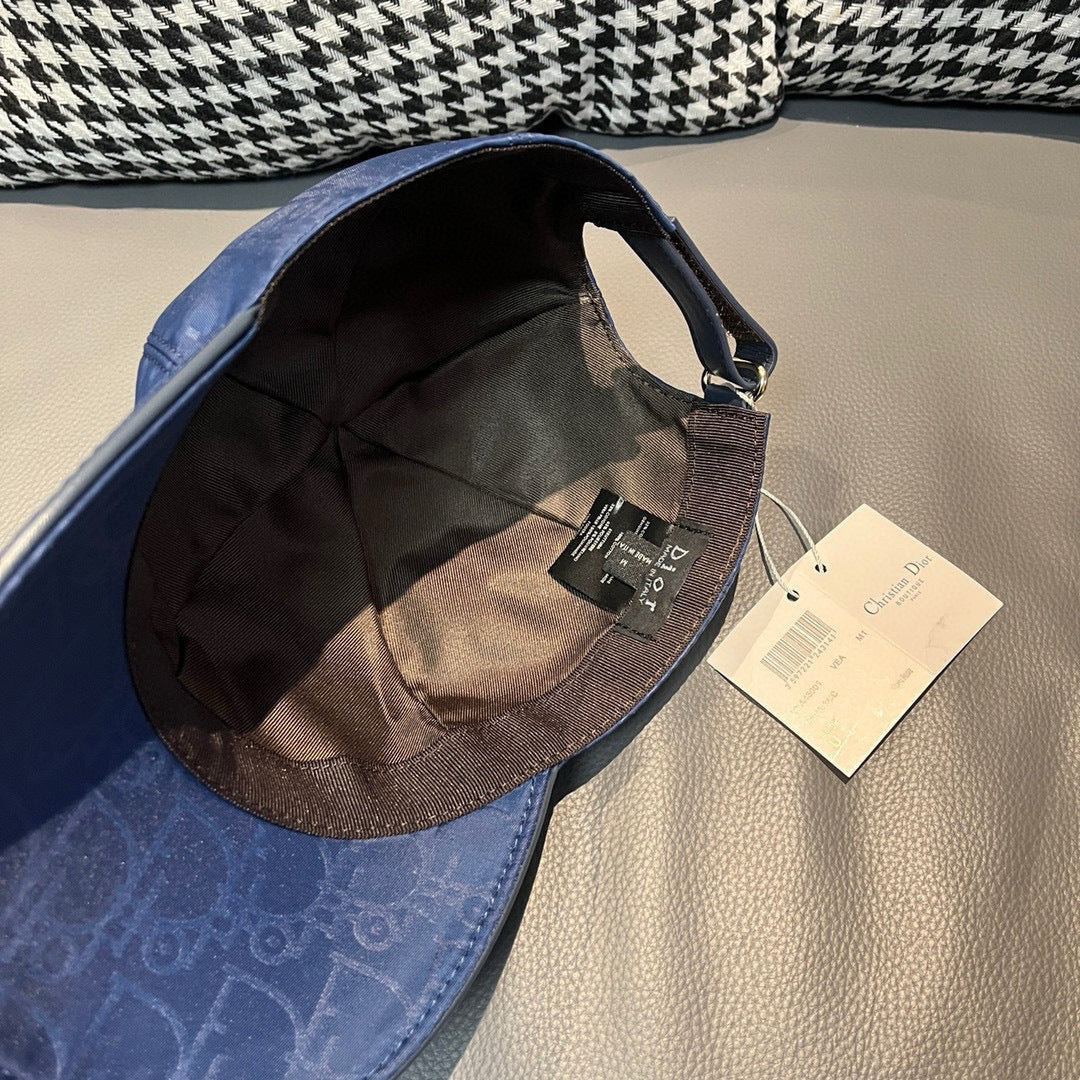 Dior cap with blue exterior and black interior, adjustable strap and hanging tag.