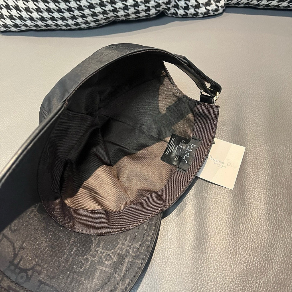Dior cap interior view with adjustable strap and fabric lining in dark tones