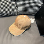 Beige monogram baseball cap with curved brim and stitched panel seams