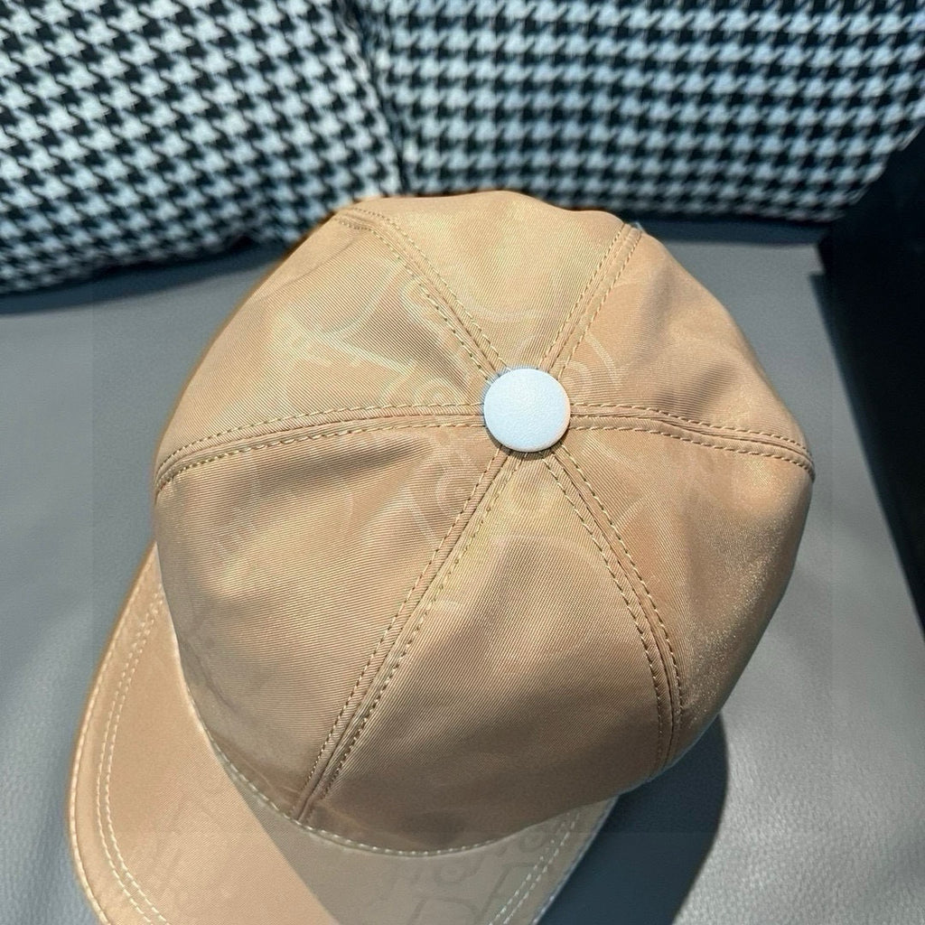 Beige monogram baseball cap top view with round button and seam stitching