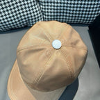 Beige monogram baseball cap top view with round button and seam stitching