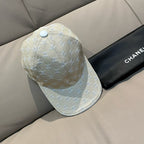 Beige monogram baseball cap, side view with curved brim and round top button
