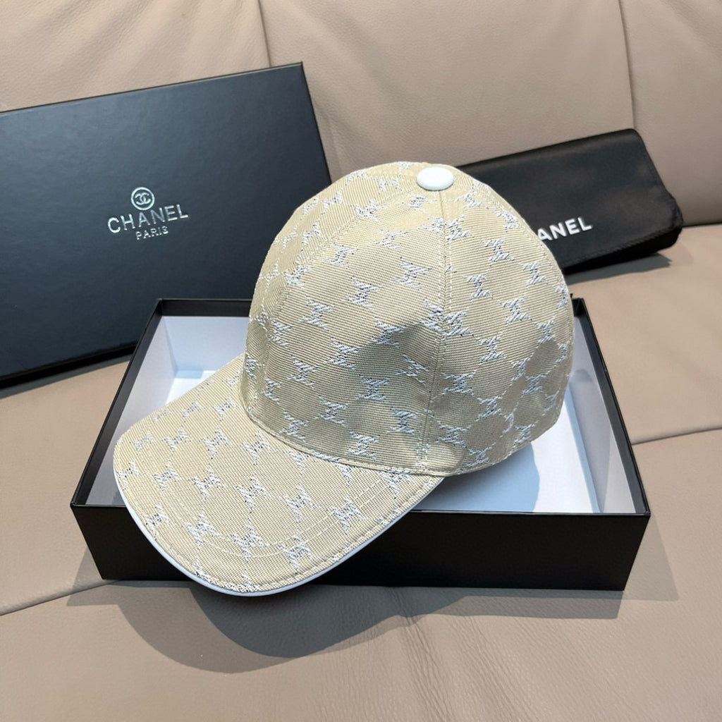 Beige monogram baseball cap with matching brim and round top button on display box