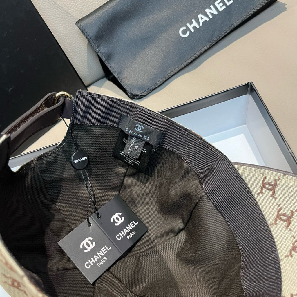 Chanel cap interior view with black lining and adjustable strap, tags visible
