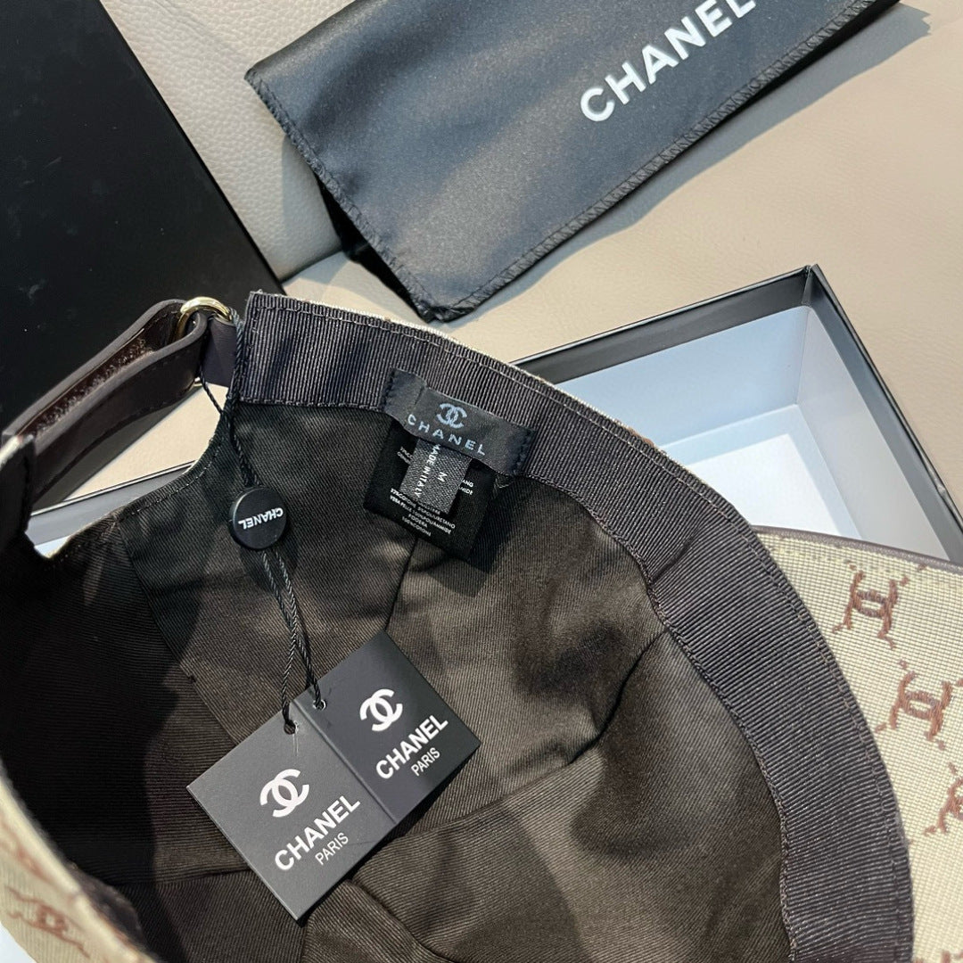 Chanel cap interior view with black lining and adjustable strap, tags visible