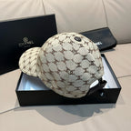 Chanel baseball cap in beige monogram canvas with curved brim and top button, back view