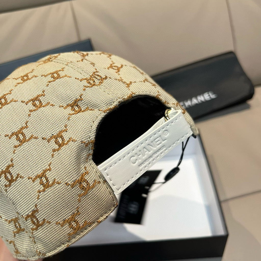 Beige monogram baseball cap side with white CHANEL patch and curved brim