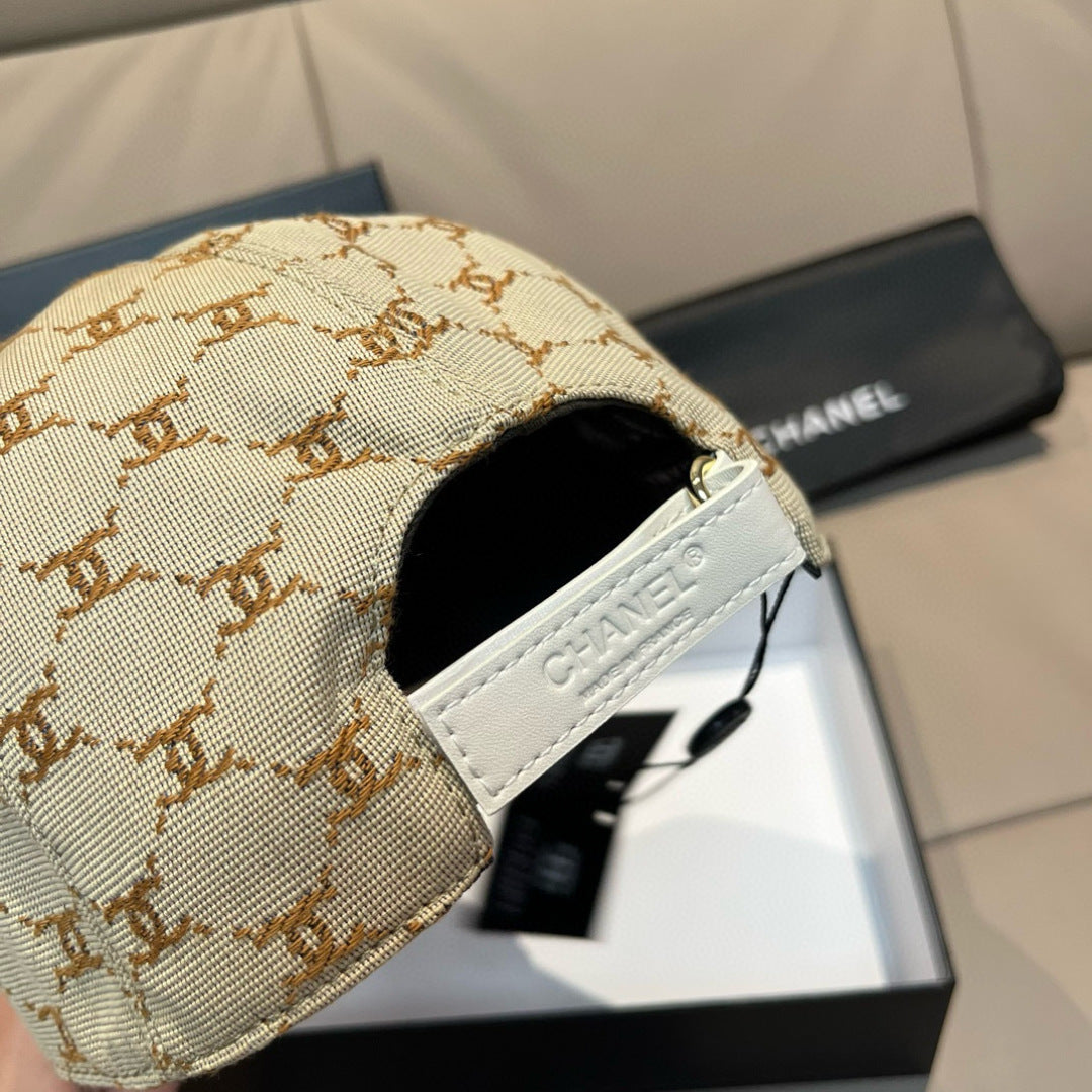 Beige monogram baseball cap side with white CHANEL patch and curved brim