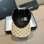 Beige monogram baseball cap with black interior lining and contrast top button