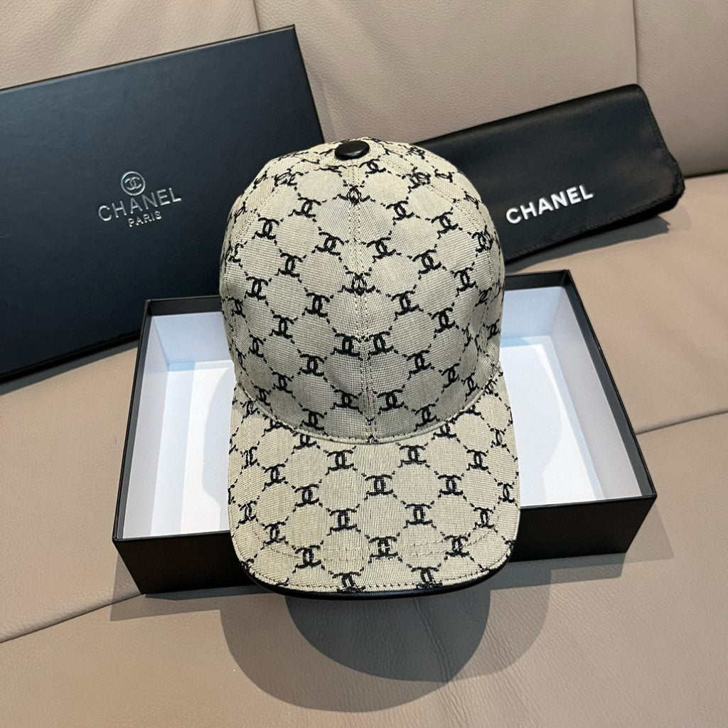 Chanel baseball cap with beige canvas and black logo pattern, curved brim