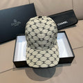 Chanel baseball cap with beige canvas and black logo pattern, curved brim
