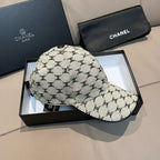 Chanel baseball cap with beige-and-black monogram pattern, curved visor