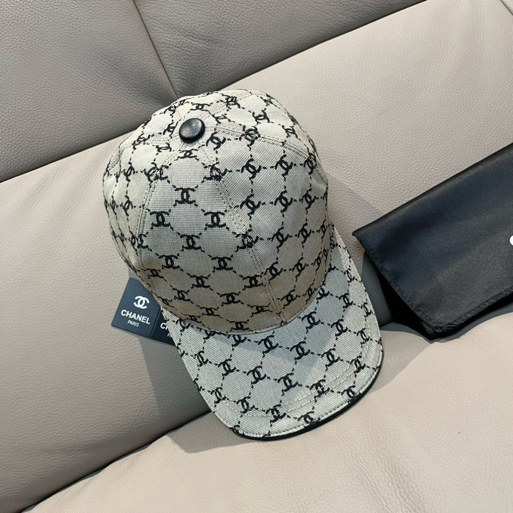 Chanel baseball cap with beige canvas and repeating black logo print, snap button