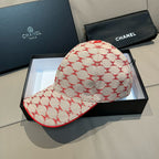 Logo baseball cap with red-trimmed brim and cream crown pattern