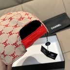 Baseball cap with logo fabric and red leather strap detail on side