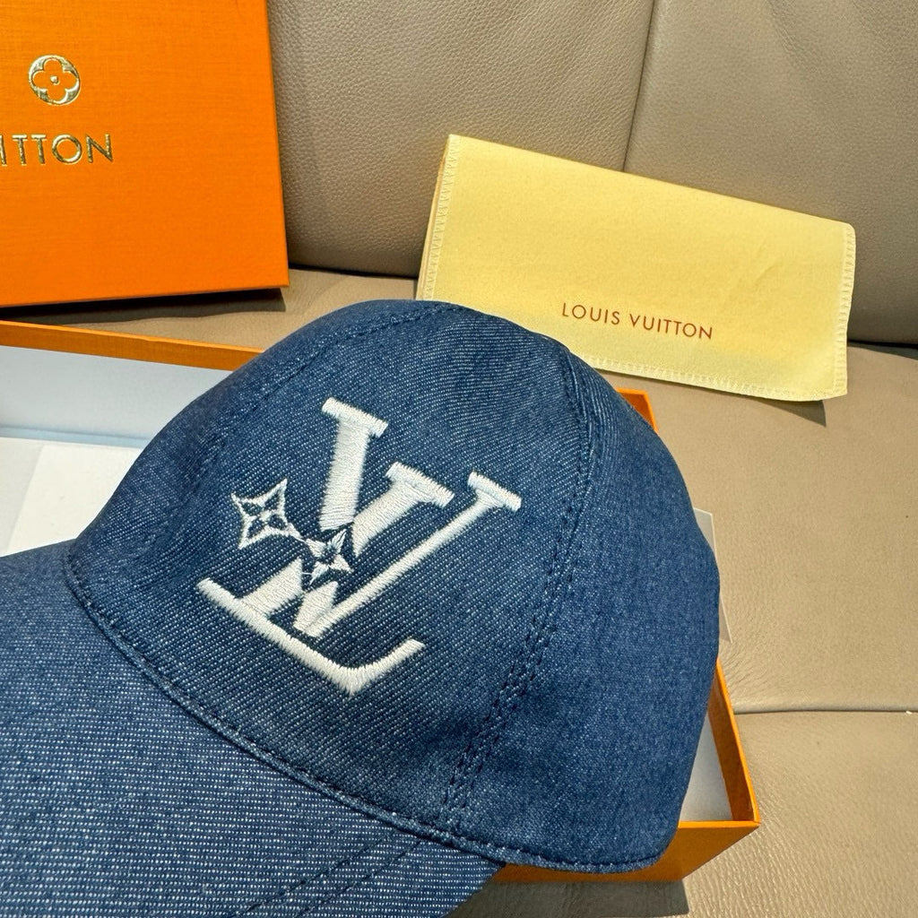 Blue denim baseball cap with prominent white logo embroidery on front