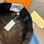 Blue denim baseball cap interior view with size tag and black lining.