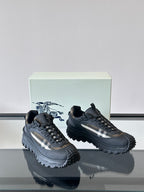 Black lace-up chunky sneakers with check-style side panel and serrated outsole