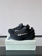 Black lace-up chunky sneakers with check-style side panel and thick outsole