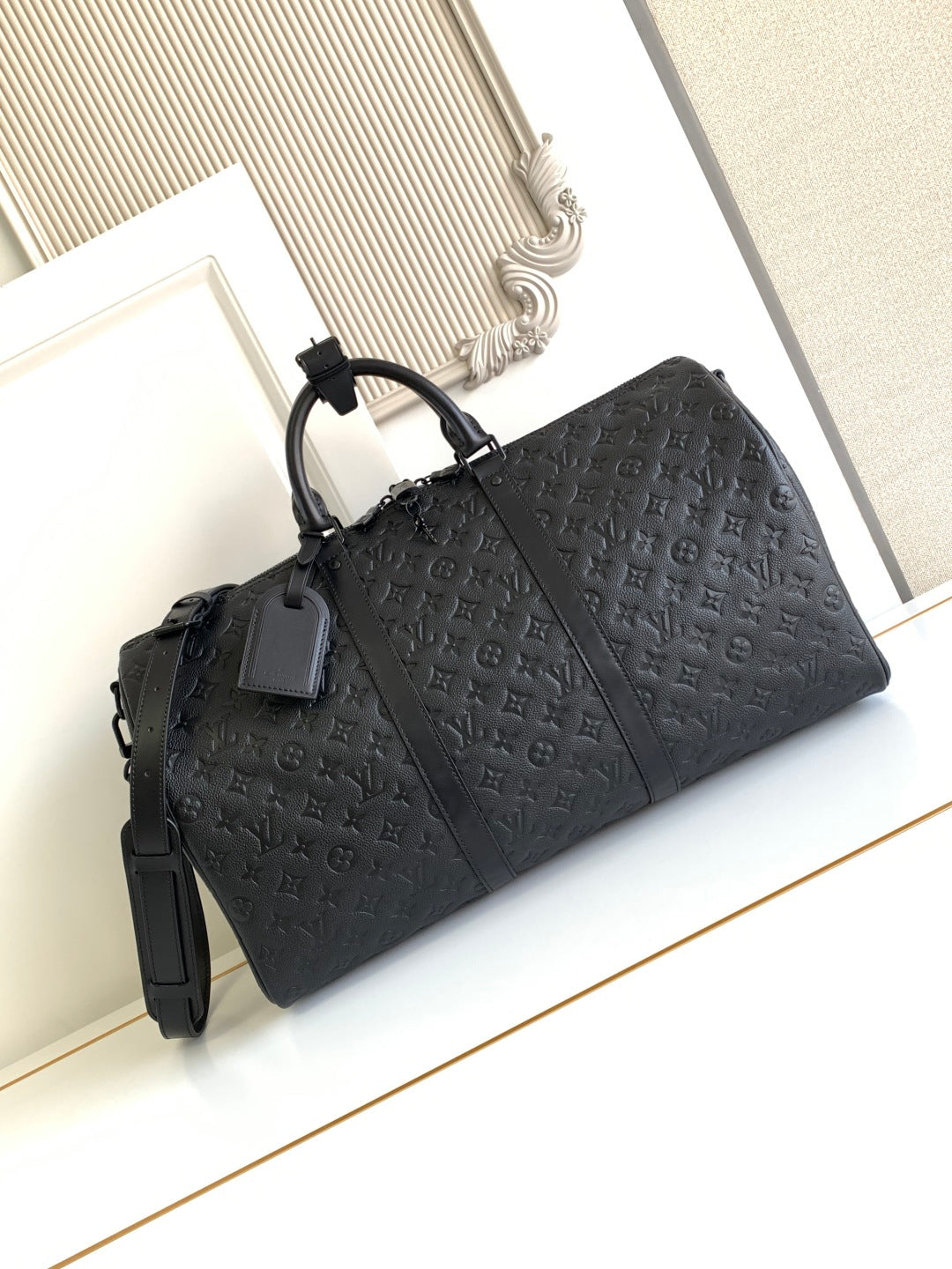 Louis Vuitton monogram duffel bag, black with top handles and side straps