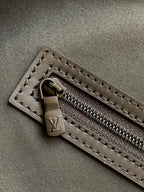 Black monogram duffel bag zipper pull and track with leather tab detail