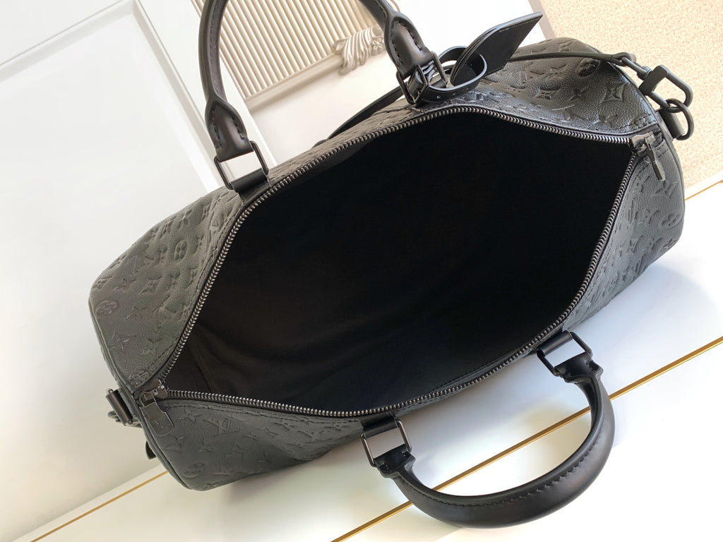 Black monogram duffel bag open top with zipper track and interior lining