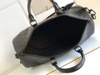 Black monogram duffel bag open top with zipper track and interior lining