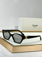 Black rectangular eyeglasses with dark lenses and gold C detail on the bridge