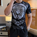 Versace graphic T-shirt and shorts set, black with large baroque face print and silver swirls