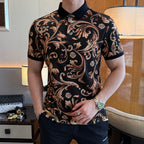 Ornate print polo shirt with short sleeves, black collar, and black trim on cuffs